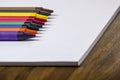 Color crayons on white paper Royalty Free Stock Photo