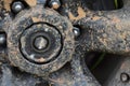 Color detail shot of an off-road car`s wheel, covered in mud Royalty Free Stock Photo