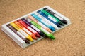 Color drawing crayons on a cork board Royalty Free Stock Photo