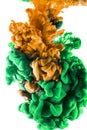 Color drop. Orange and green ink on white background. Royalty Free Stock Photo