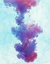 Color drop underwater creating a silk drapery. Ink swirling underwater Royalty Free Stock Photo