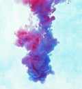 Color drop underwater creating a silk drapery. Ink swirling underwater Royalty Free Stock Photo