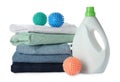 Color dryer balls, laundry detergent and stacked clean clothes on white background