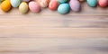 Color easter eggs on a wood background - Celebration design