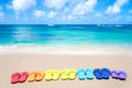 Color flip flops by the ocean