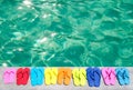 Color flip flops by the pool