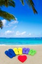 Color flip flops on sandy beach