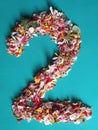 color flower petals forming the number 2 and green backgruound
