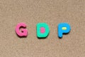 Color foam alphabet in word GDP (Gross domestic product or Good distribution practice) on cork board background Royalty Free Stock Photo