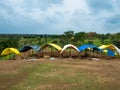 Color full shopkeepers huts line up, blue grey sky Royalty Free Stock Photo