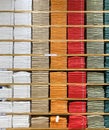 Color full stack of t-shirt in shopping mall or department store. Shelves with colorful T-shirts Royalty Free Stock Photo