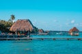 Color graded picture of a pier with clouds and blue water at the Laguna Bacalar, Chetumal, Quintana Roo, Mexico