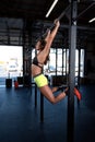 Color image of an athletic woman in a gym working out