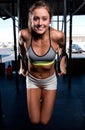 Color image of an athletic woman in a gym working out