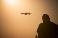Man flying a drone at sunrise Royalty Free Stock Photo
