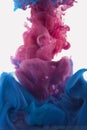 Color ink drop in water. redish violet, deep blue Royalty Free Stock Photo