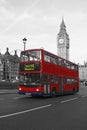 Color isolated red double-decker bus near Big Ben in London Royalty Free Stock Photo