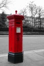 Color isolated Victorian hexagonal red post box of the Penfold type in London Royalty Free Stock Photo