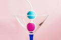 Color Kegel balls in a triangle cocktail glass. Concept of women health Royalty Free Stock Photo