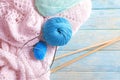 Color knitting yarn with needles on wooden table Royalty Free Stock Photo