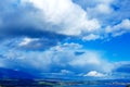 Color landscape with storm clouds, green and