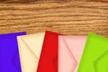 Color letters envelopes on wooden texture close-up Royalty Free Stock Photo