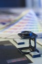 Color management with magnifying glass and color swatches Royalty Free Stock Photo