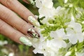 Color manicure with pastel and pearl nail polishes Royalty Free Stock Photo