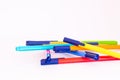 Color markers disposed randomly, white background Royalty Free Stock Photo