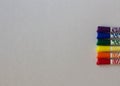 Colored LGBT markers on a white background close-up