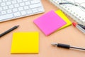 Color note paper with pen on computer desk Royalty Free Stock Photo