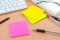 Color note paper with pen on computer desk Royalty Free Stock Photo