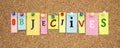 Color notes with letters pinned on a cork board. Word OBJECTIVES Royalty Free Stock Photo