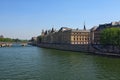 Color outdoor Paris cityscape photo. Bridge Pont au Change over Seine river in Paris, France. Building of French court of appeal