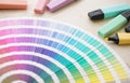 A color palette and colorful highlighters or markers