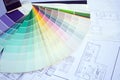 Color palette samples lie on house design drawings Royalty Free Stock Photo