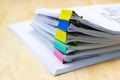 Color paper clip with Stack of papers documents Royalty Free Stock Photo