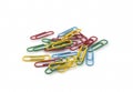 Color paperclips on white background. Royalty Free Stock Photo