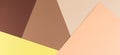 Color papers geometry composition background with yellow, beige and brown tones. Royalty Free Stock Photo