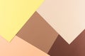 Color papers geometry composition background with yellow pink, beige and brown tones. Royalty Free Stock Photo