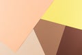 Color papers geometry composition background with yellow pink, beige and brown tones. Royalty Free Stock Photo