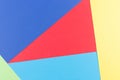Color papers geometry flat composition background with yellow, green, red and blue tones Royalty Free Stock Photo