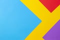 Color papers geometry flat composition background with yellow red blue and purple tones