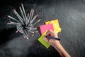 Color pencil with block notes on a dark background Royalty Free Stock Photo