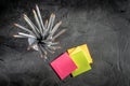 Color pencil with block notes on a dark background Royalty Free Stock Photo