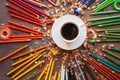 Color pencil and a cup of coffee on wooden background Royalty Free Stock Photo