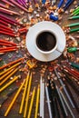 Color pencil and a cup of coffee on wooden background Royalty Free Stock Photo