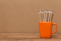 Color pencil in the cup on wooden background Royalty Free Stock Photo