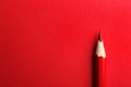 Color pencil on red background Royalty Free Stock Photo