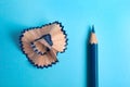 Color pencil and shaving on blue background Royalty Free Stock Photo